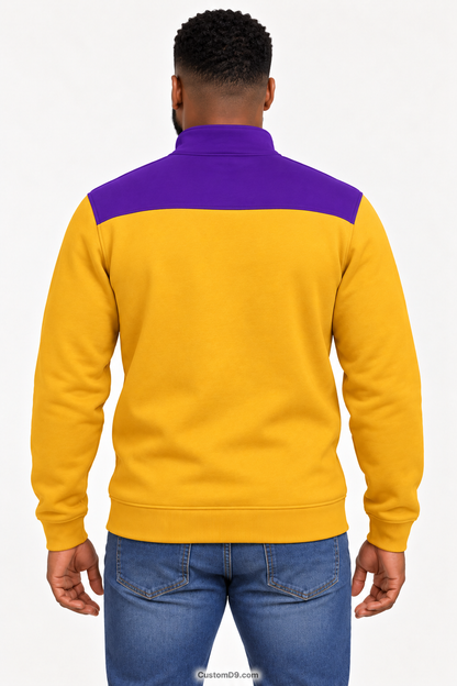 Black male model showing back of Omega Psi Phi old gold quarter-zip with royal purple shoulder panel