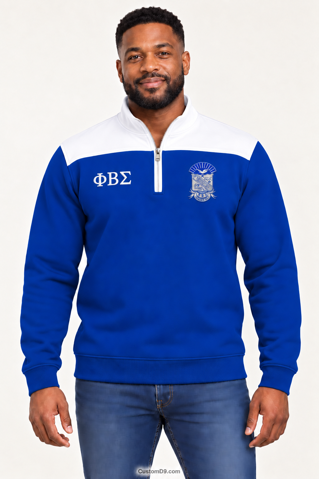 Black male model showing front of Phi Beta Sigma royal blue quarter-zip with white shoulder panel