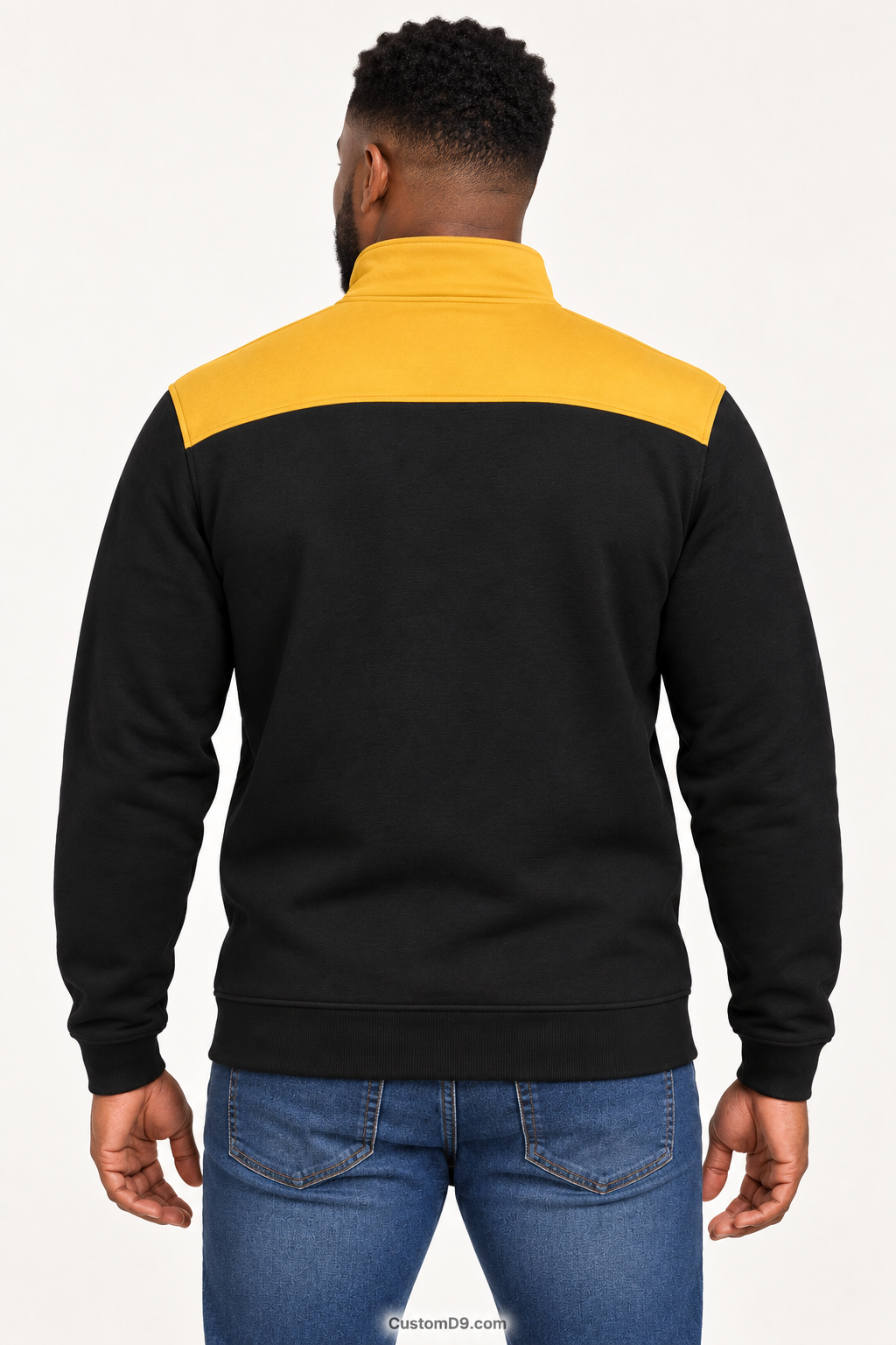 Black male model showing back of Alpha Phi Alpha black quarter-zip with old gold shoulder panel