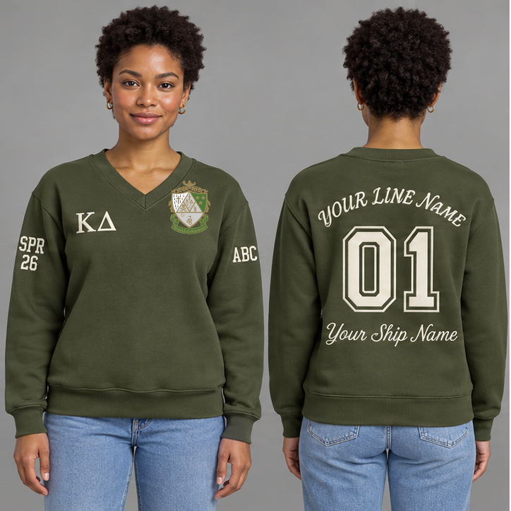 Kappa Delta Olive Green V-neck sweatshirt on an adult model with Pearl White Greek letters ΚΔ, original supplied crest, sample line name, number 01 and ship name, crossing year and chapter initials on sleeves.