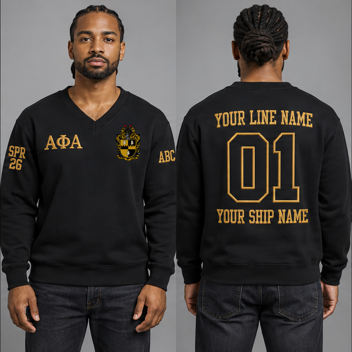 Alpha Phi Alpha Black V-neck sweatshirt on an adult model with Old Gold Greek letters ΑΦΑ, original supplied crest, sample line name, number 01 and ship name, crossing year and chapter initials on sleeves.