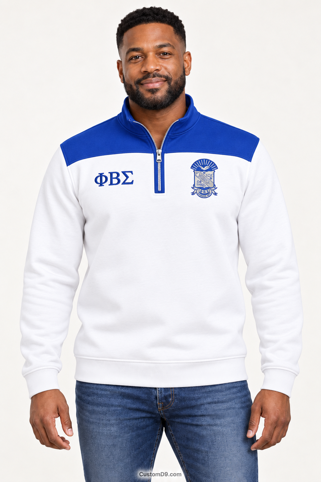 Black male model showing front of Phi Beta Sigma white quarter-zip with royal blue shoulder panel
