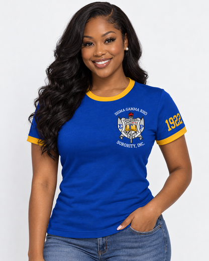 Model wearing a royal blue Sigma Gamma Rho ringer T-shirt with gold trim, chest crest and 1922 sleeve design