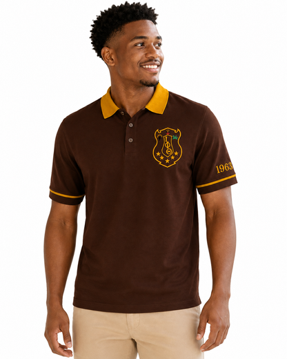 Studio model wearing an Iota Phi Theta brown and gold embroidered polo