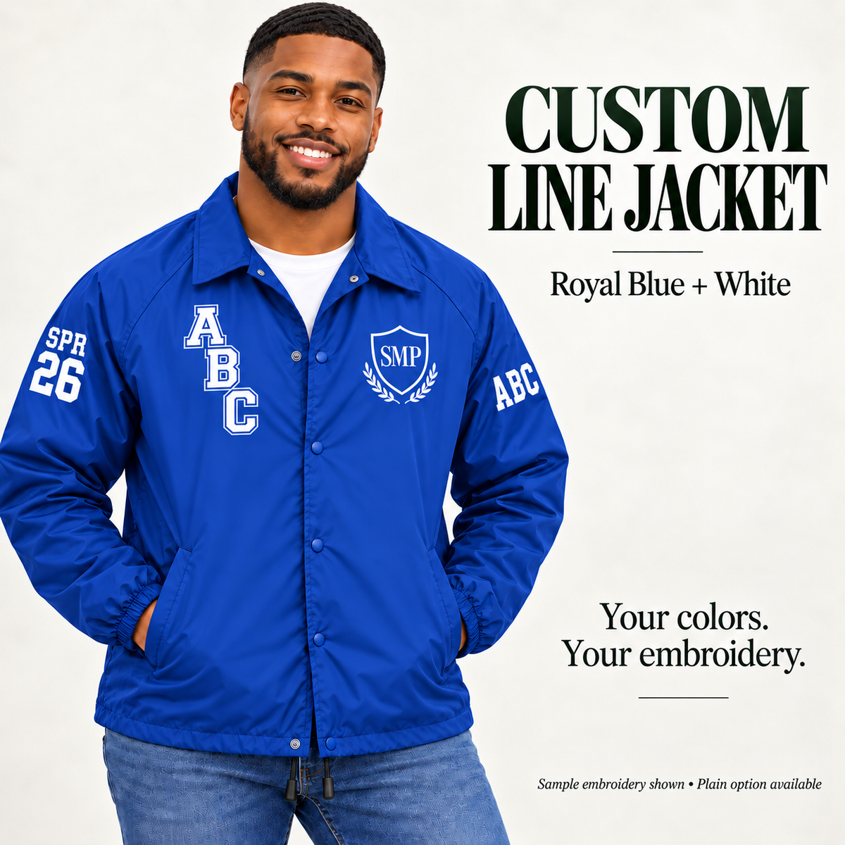 Royal Blue nylon snap-front line jacket with white sample embroidery on a male model