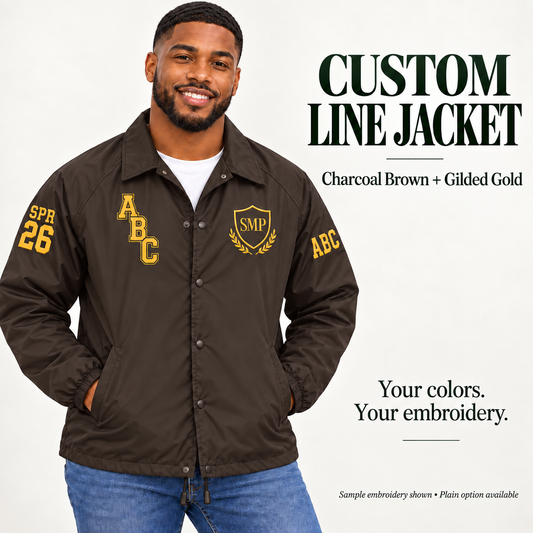 Charcoal Brown nylon snap-front line jacket with gilded gold sample embroidery on a male model