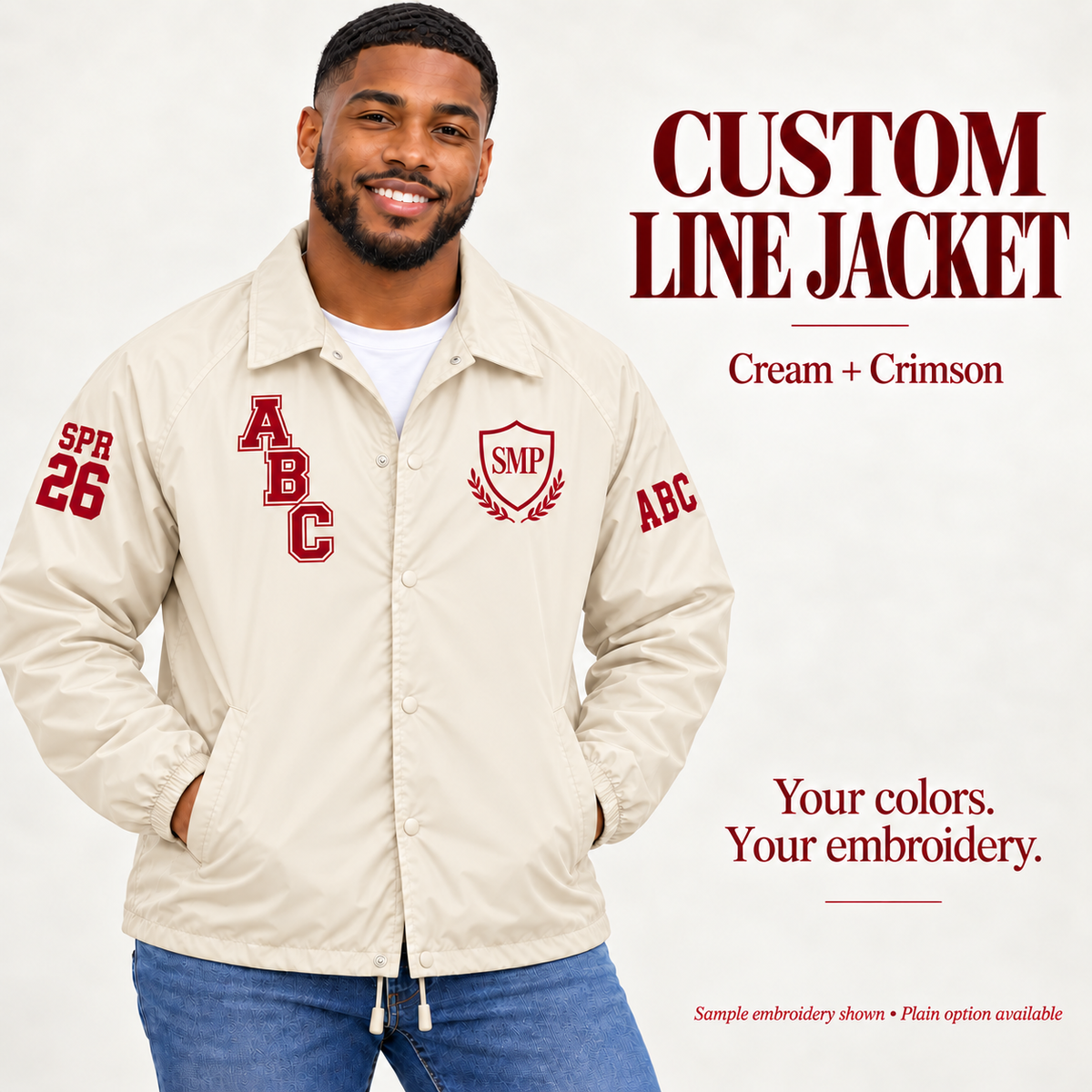 Cream nylon snap-front line jacket with crimson sample embroidery on a male model