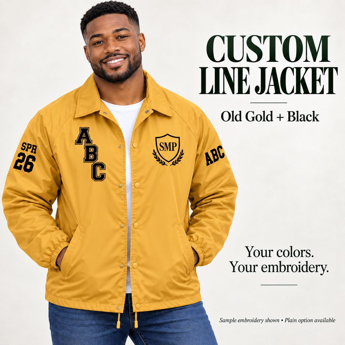 Old Gold nylon snap-front line jacket with black sample embroidery on a male model