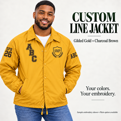 Gilded Gold nylon snap-front line jacket with charcoal brown sample embroidery on a male model