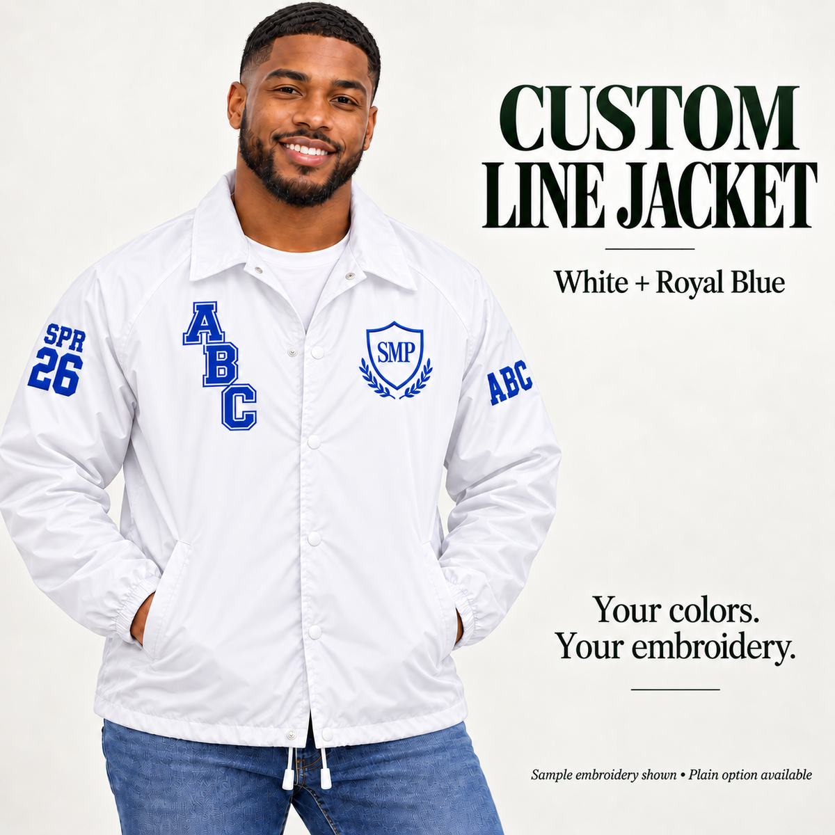 White nylon snap-front line jacket with royal blue sample embroidery on a male model