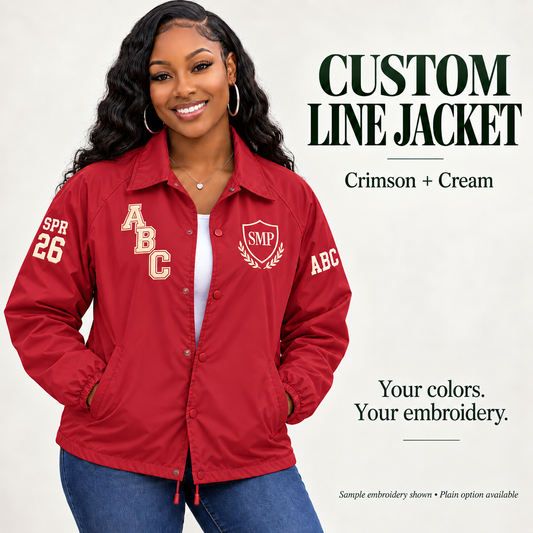 Crimson nylon snap-front line jacket with cream sample embroidery on a female model