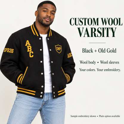 Man wearing Black wool body and wool sleeve varsity jacket with Old Gold sample embroidery