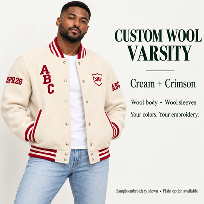 Man wearing Cream wool body and wool sleeve varsity jacket with Crimson sample embroidery