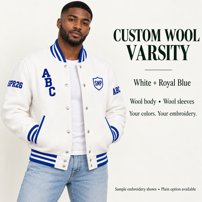 Man wearing White wool body and wool sleeve varsity jacket with Royal Blue sample embroidery
