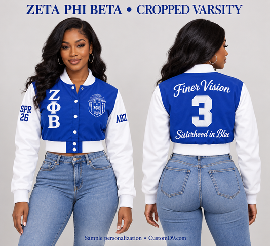 Zeta Phi Beta royal blue and white cropped satin varsity jacket shown on a model in front and back with sample custom embroidery